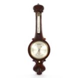 A Victorian rosewood banjo shaped barometer by Eames & Sons (Broad Street, Bath).