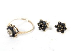 A 9ct gold ladies daisy sapphire and diamond dress ring and a pair of similar earnings.