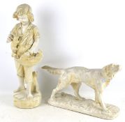 Two vintage plaster figures of a dog and a boy with a basket kittens,