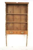 Early 20th Century pine wall hanging plate rack.