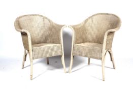 A pair of vintage Lloyd Loom 'Lusty' armchairs.