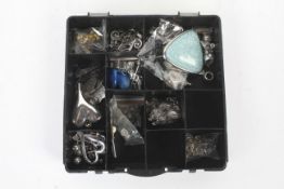 A small quantity of jewellery making items in a compartmentalised box.