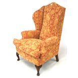 A wingback armchair.