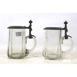 A pair of glass tankards with pewter mounts. H16cm.