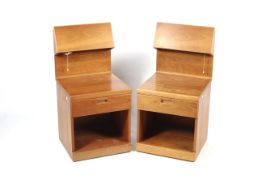 A pair of mid-century electrified bedside tables in the Scandinavian style.