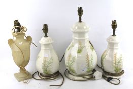 A set of three table lamps and one other.