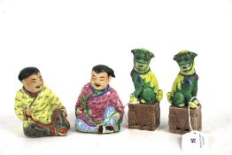 Two Chinese Republic period porcelain children and two Fo-dogs. Tallest measures H11cm.