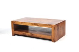 A contemporary wooden rectangular coffee table.