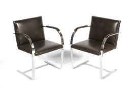 Two 1980s chrome cantilevered armchairs.