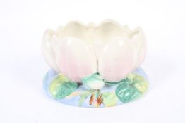A Clarice cliff water lilly bowl. Of moulded form on a lily pad and water raised base.