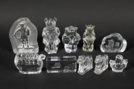 A group of press-moulded Swedish Art Glass models of Vikings and longboats, probably Pukeberg.