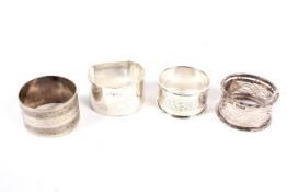 Four assorted silver napkin rings various makers.