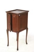 A mahogany pot cabinet. With two doors raised on square tapering supports, H93cm x D44cm x W39cm.