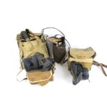 Four assorted WWII gas masks. With a military No 4 mk III B7'41 in original canvas bag, etc.