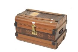 A metal bound trunk. Brown exterior finish with a green interior finish, H41cm x W65cm x D44cm.