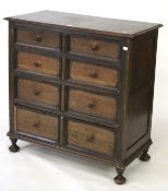 A chest of drawers. Comprising four drawers with wooden handles on ball feet, H93cm x D46cm x W91cm.