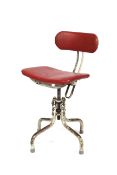 A mid-century Industrial style adjustable chair.