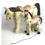Two Far Eastern carved and painted wooden horses. One made as a puppet with jointed legs. Max.