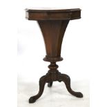 A Victorian walnut octagonal work box table having hinged cover.