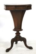 A Victorian walnut octagonal work box table having hinged cover.