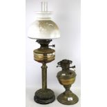 ON eoil lamp and one part lamp. One with glass and shade, H73cm, the other a brass lamp base.