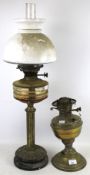 ON eoil lamp and one part lamp. One with glass and shade, H73cm, the other a brass lamp base.