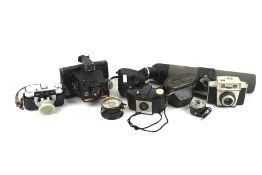 A group of six assorted vintage film cameras.