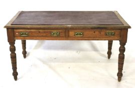 A Victorian oak writing table.