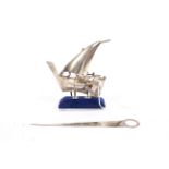 A continental silver model of boat under full sail on stand stamped 925, 52.3 grams.