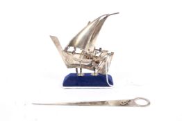 A continental silver model of boat under full sail on stand stamped 925, 52.3 grams.