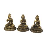 Three Tibetan-style metal seated Buddhas. Measuring H11cm.