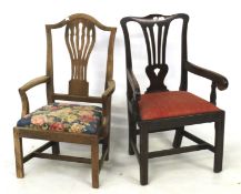 Two floral armchairs. Both shield backed one upholstered in red, H94cm x D44cm x W54cm.