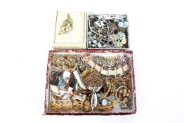 Three boxes of assorted costume jewellery. Including trifari, bracelets, necklaces, brooches, etc.