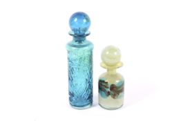 Two Mdina blue glass decanters and ball stoppers.