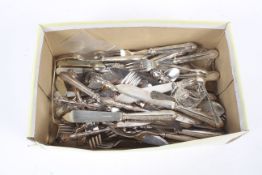 A box of assorted flatware.