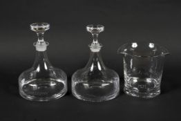 Two Dartington glass ships decanters and stoppers and a large wine glass rinser.