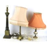 Three assorted brass table lamps.
