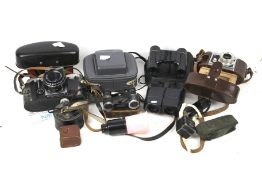 Six vintage cameras and binoculars.