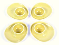 A set of four mid-century yellow glazed pottery egg cups by Figgjo Flint (Norway).