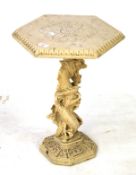 An occasional table of stone construction with dragon stand and hexagonal top. H54cm D38cm.