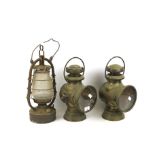 A pair of vintage Lucas brass car head lamps and a storm lantern. The first 'King of the Road'.