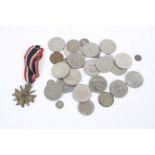 An assortment of coinage and a German crossed sword medal dated 1939 on ribbon.