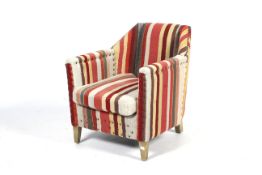 A contemporary striped Art Deco style bedroom armchair.