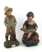 Two vintage polychrome plaster figures of boys.