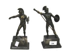 Two spelter figures of soldiers on metal base. H22cm.