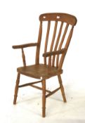 A country farmhouse open elbow chair. A Windsor style ash and elm lathe back chair.