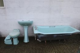 bathroom suite. Comprises tin bath, ceramic sink and toilet turquoise complete with taps etc.