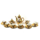 A gilt tea set. Comprising teapot, milk jug, sugar bowl and six cups and saucers.