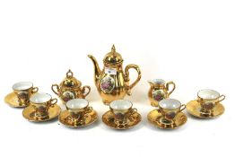 A gilt tea set. Comprising teapot, milk jug, sugar bowl and six cups and saucers.