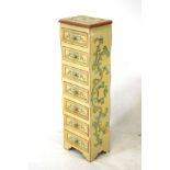 Tall wooden chest with floral decoration, containing seven drawers. H96cm.